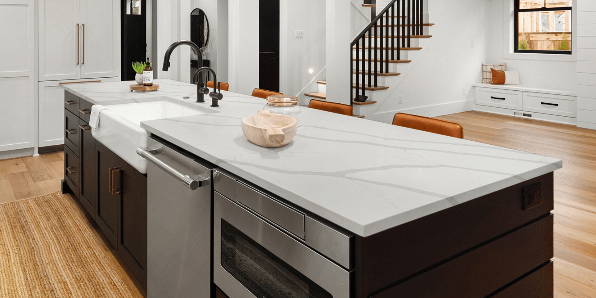 New construction kitchen with a Calacatta quartz island installed by Blue Sky Countertops